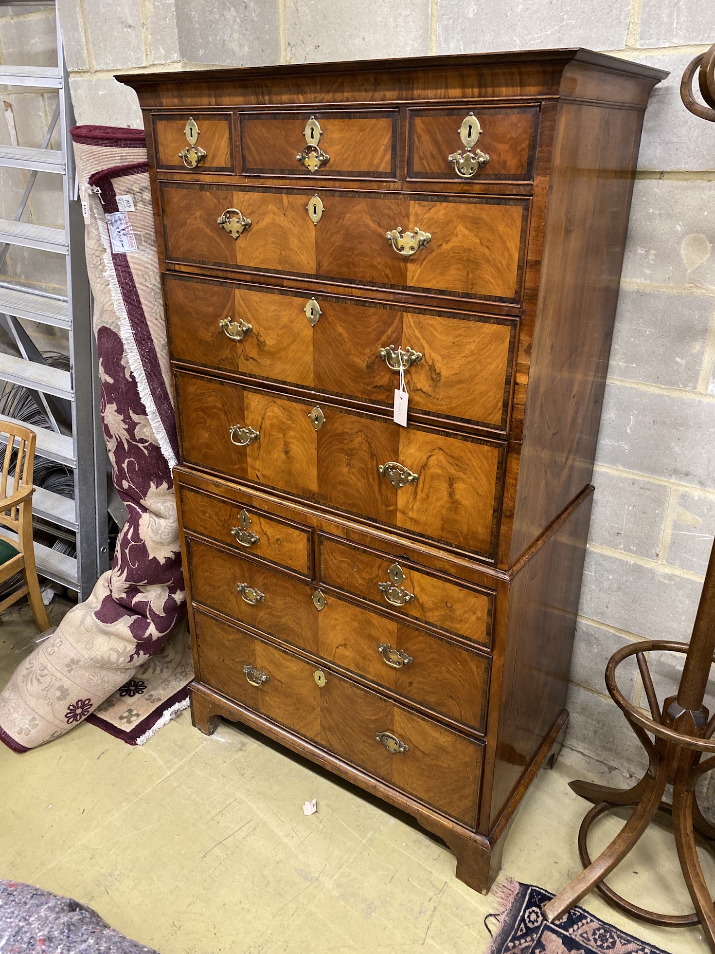 A George III banded walnut chest on chest, width 100cm, depth 52cm, height 177cm